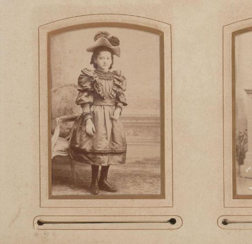 Portrait of a standing girl with a hat