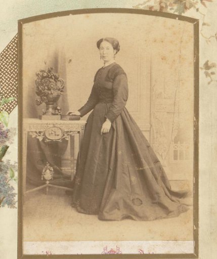 Portrait of a Woman Standing Beside a Table with Books