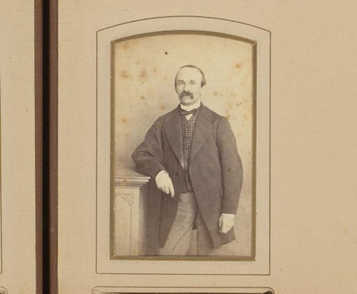 Portrait of a Man Standing by a Pillar
