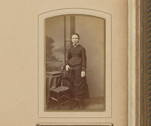Portrait of a Girl Standing by a Chair