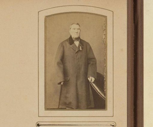 Portrait of a standing man in an overcoat