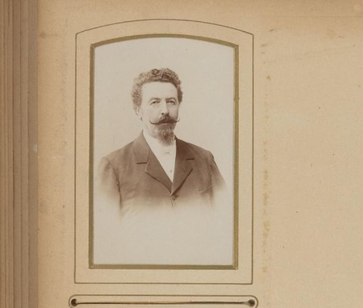 Portrait of a man with a mustache and sideburns