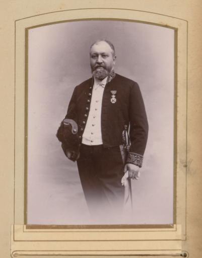 Portrait of a Man with a Hat, Gloves in His Hand, and an Insignia on His Coat