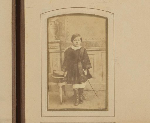 Portrait of a standing girl with hat and whip