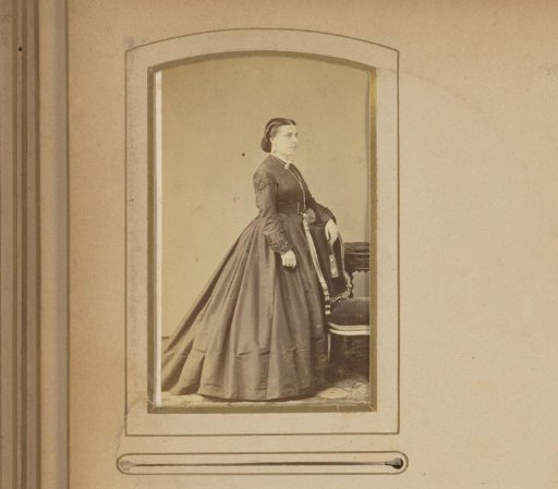 Portrait of a Woman Standing Beside a Chair