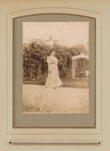 Portrait of a Woman Standing in a Garden