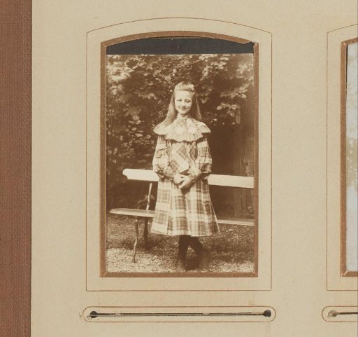 Portrait of a Girl Standing Before a Bench in a Garden