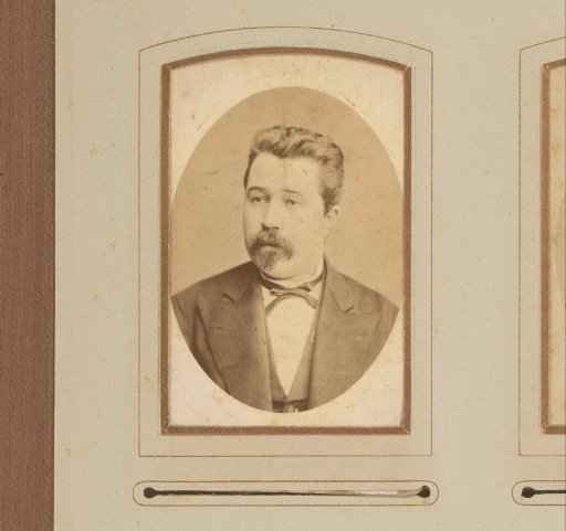 Portrait of a man with a moustache and sideburns