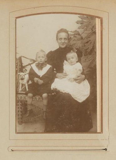Portrait of a seated woman and two children