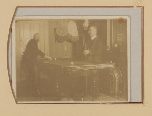 Two Men Playing Billiards