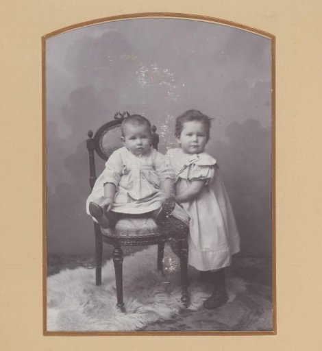 Portrait of a Standing Girl and a Seated Baby