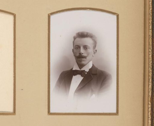 Portrait of a man with a mustache and bow tie