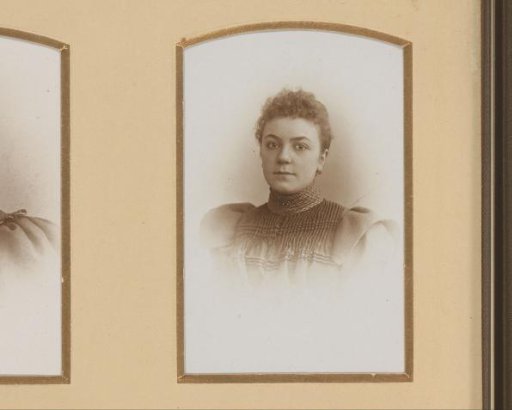 Portrait of a young woman in a high-collared dress