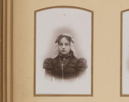 Portrait of a Young Woman in a White Traditional Cap and Spectacles