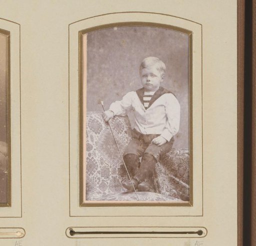 Portrait of a Seated Boy in a Sailor's Suit Holding a Whip