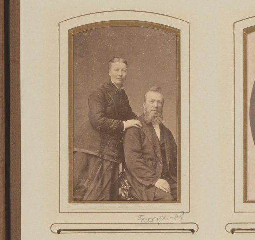 Portrait of a standing woman and a seated man