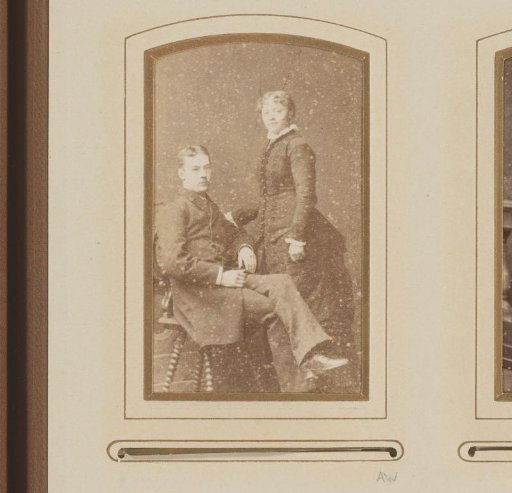 Portrait of a seated man and a standing woman