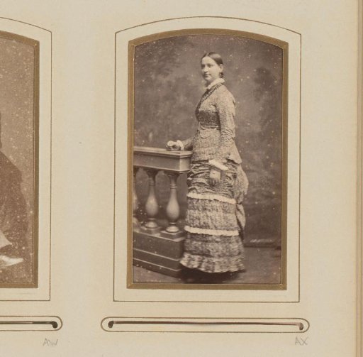 Portrait of a woman, standing by a balustrade