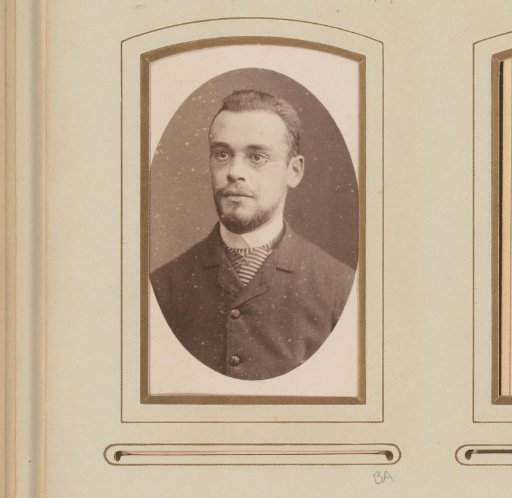 Portrait of a man with a moustache, beard and spectacles