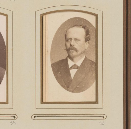 Portrait of a man with a moustache and spectacles