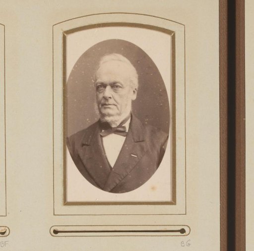 Portrait of a man with a ring beard and a butterfly bow