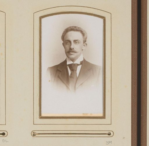Portrait of a man with a mustache and necktie