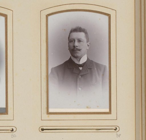Portrait of a man with a mustache and bow tie
