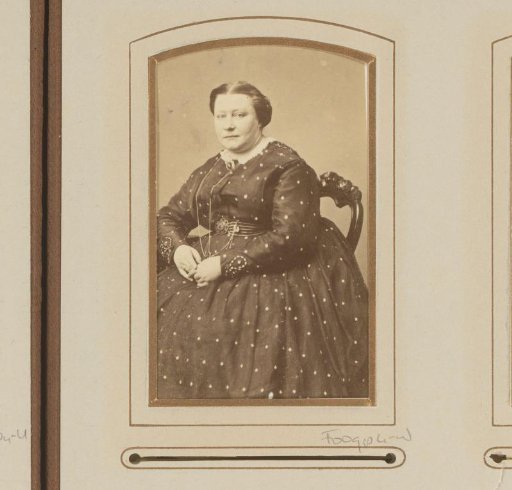 Portrait of a seated woman in a quilted dress