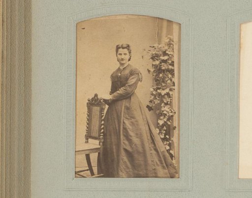Portrait of an unknown woman by a chair