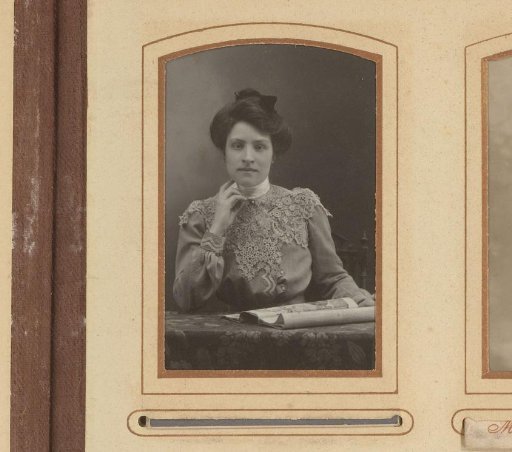 Portrait of a woman sitting at a table with a magazine