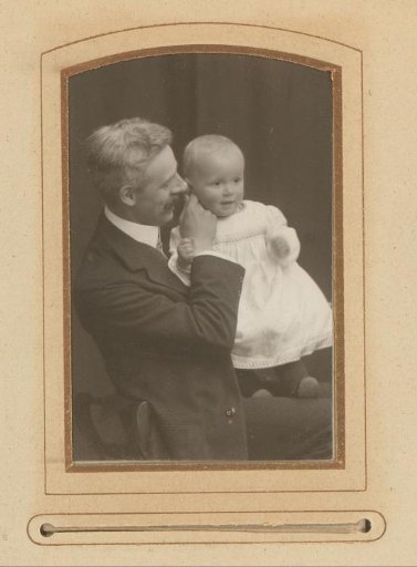 Portrait of a man with a child