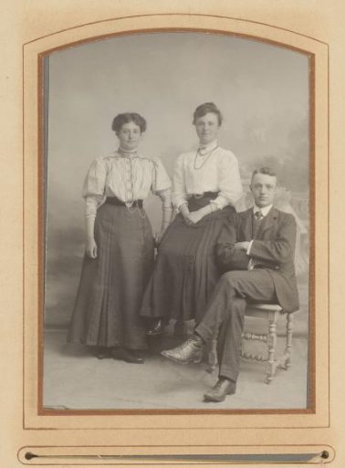 Group portrait with two women and a man