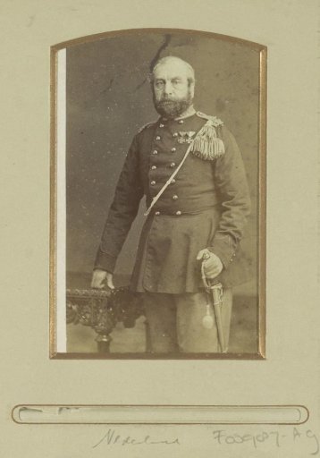 Portrait of a (presumably) Dutch soldier, standing by a table with a sabre
