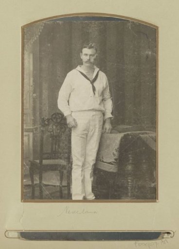 Portrait of a sailor, standing by a table, presumably in Surabaya