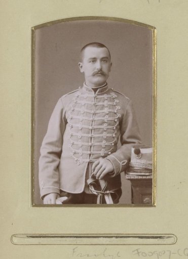 Portrait of a (possibly) French soldier, standing in a uniform jacket with braiding