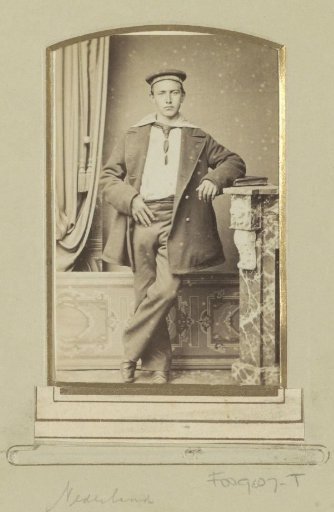 Portrait of a (presumably) Dutch sailor, standing by a fireplace