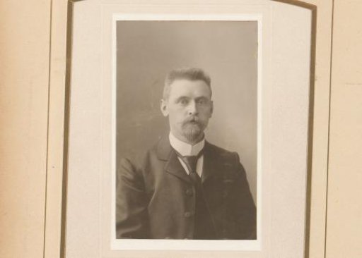 Portrait of a man with a moustache and sideburns