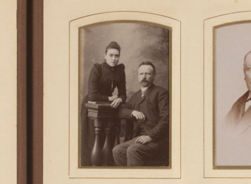 Portrait of a standing woman and a seated man at a balustrade