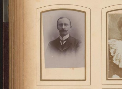 Portrait of a man with a mustache and spectacles