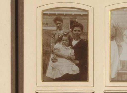 Group portrait of two women and a girl in a garden