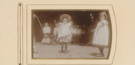 Girl jumping rope with a group of boys in the background