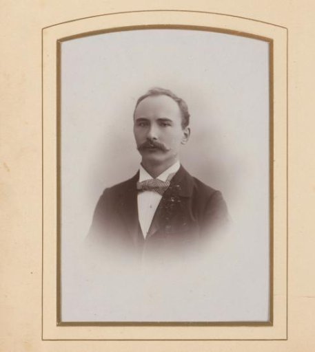 Portrait of a man with a moustache and bow tie