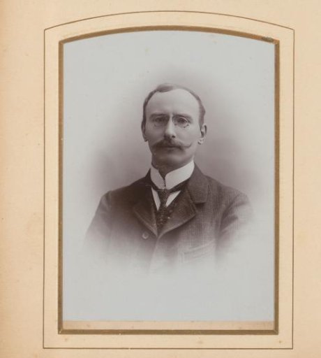 Portrait of a man with a moustache and spectacles