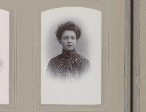 Portrait of a girl in a high-closed dress