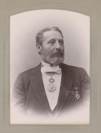 Portrait of a man with a bow tie and two insignia