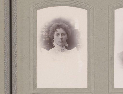 Portrait of a woman in a high-closed dress