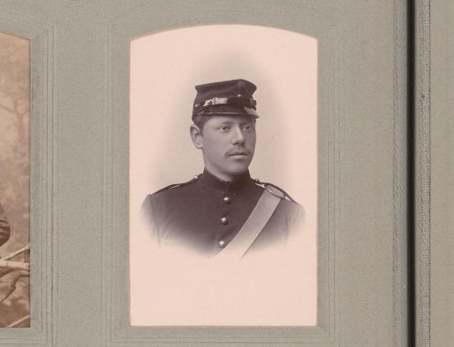 Portrait of a Man in Uniform with a Cap