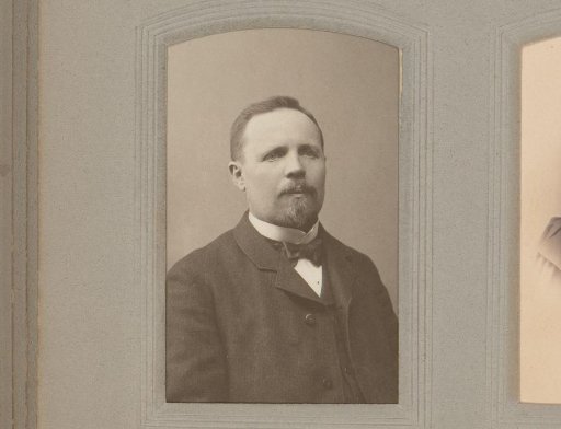 Portrait of a man with a moustache, beard and bow tie