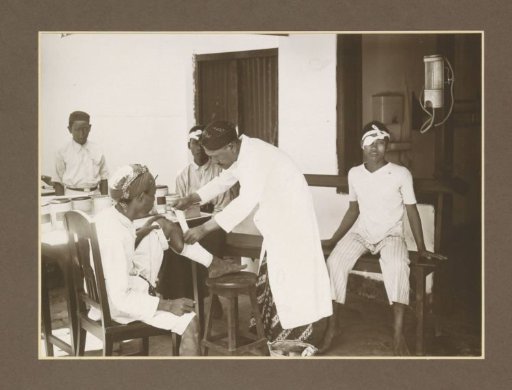 Nurse and patients in the outpatient clinic of the Boedoeran sugar factory in Sidoarjo, Java