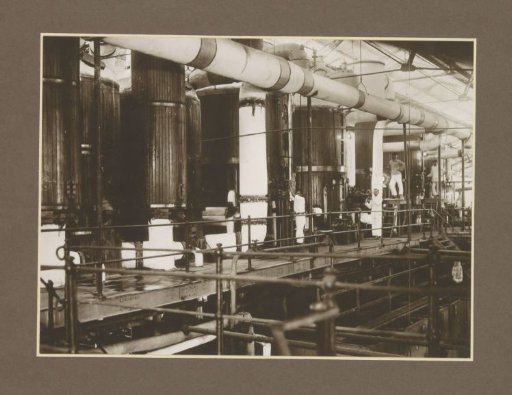 Workers in the evaporation and boiling station of the Meritjan sugar factory in Kediri, Java